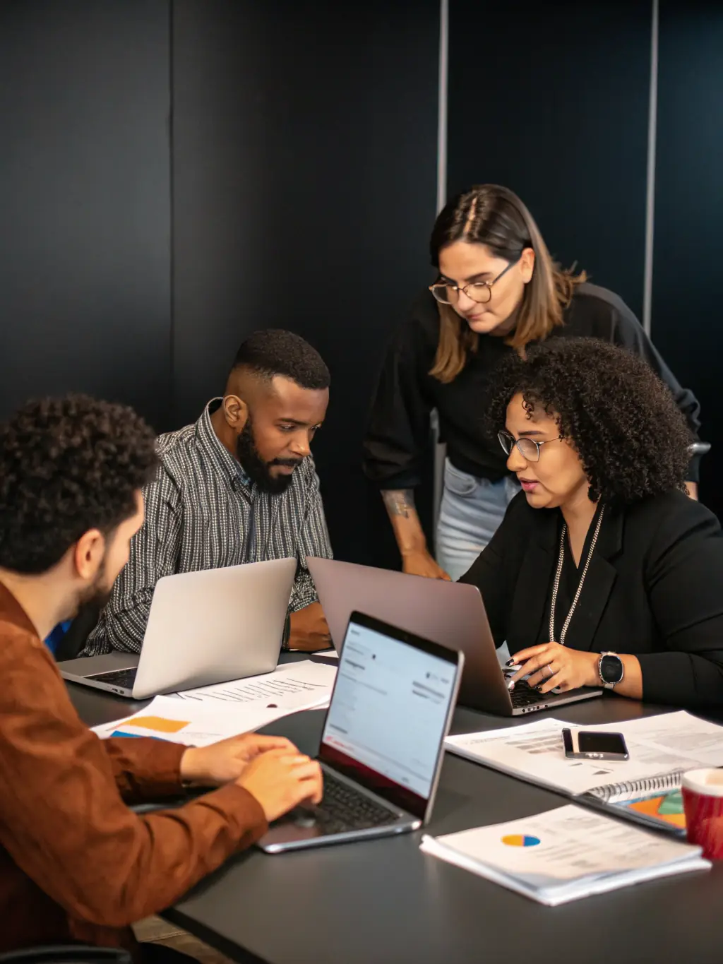 A professional team collaborating in a modern office, brainstorming innovative digital strategies for a client. The image should convey teamwork, creativity, and a client-focused approach.